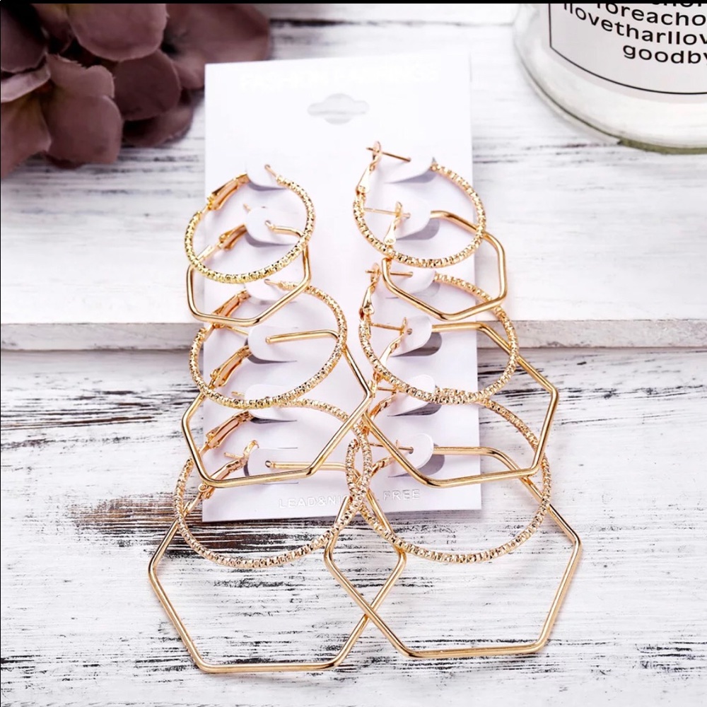 Six pair of gold tone, hoop style earrings. - Picture 2 of 2